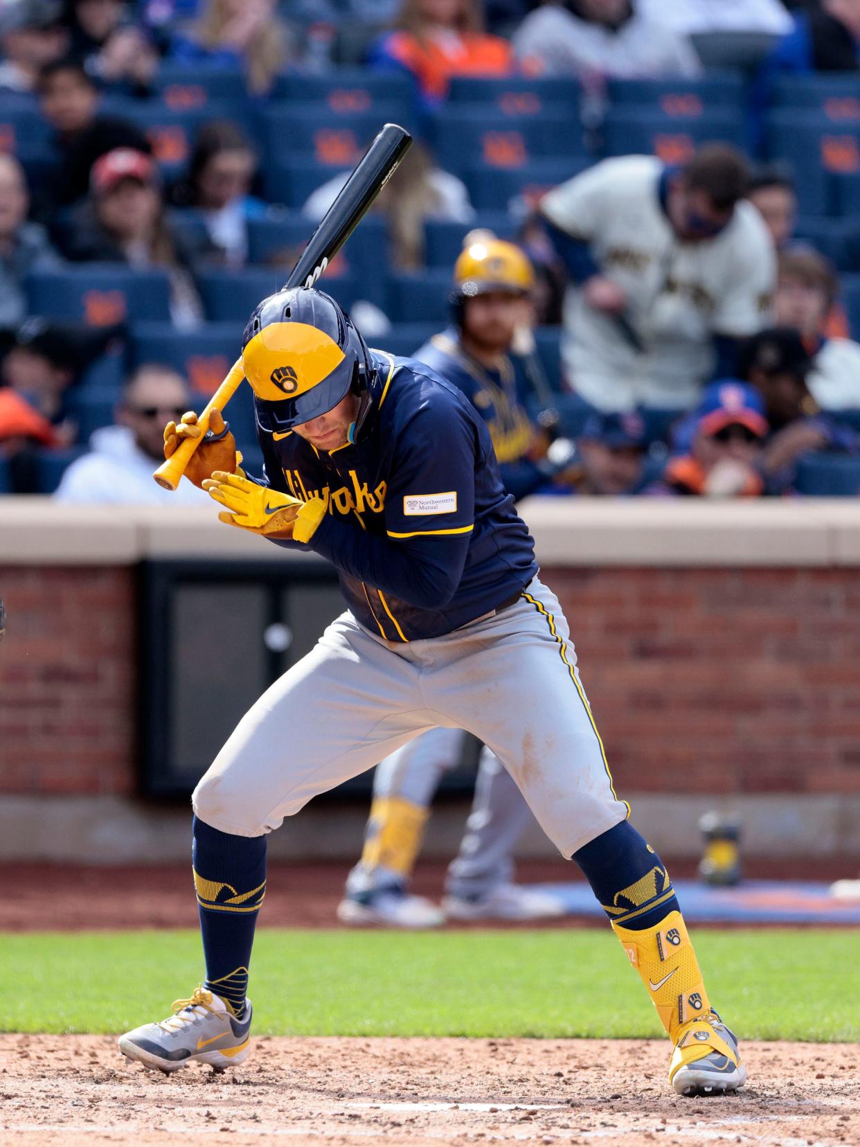 The Brewers' Rhys Hoskins ducks out of the way of a pitch thrown by Mets reliever Yohan Ramírez during the top of the seventh inning.