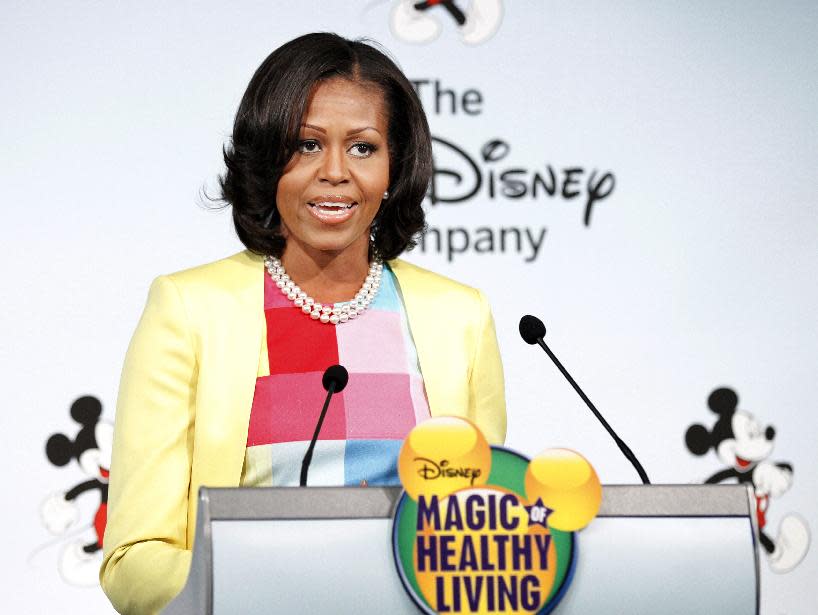 First lady Michelle Obama speaks at the Newseum in Washington, Tuesday, June 5, 2012, where she joined the Walt Disney Company to announce that Disney will become the first major media company to introduce new standards for food advertising on programming targeting kids and families. (AP Photo/Manuel Balce Ceneta)