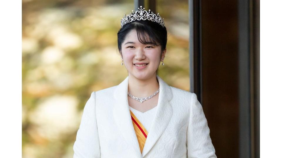 Princess Aiko in a white coat, outfit and tiara