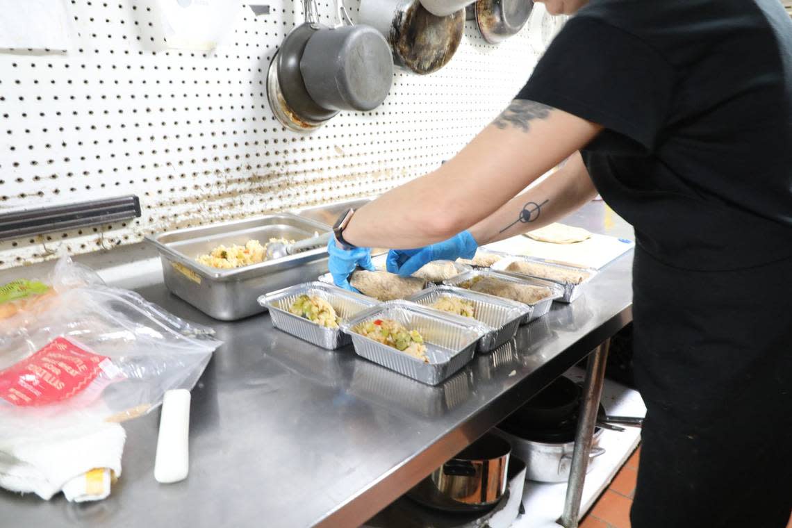 A worker packaged pre-cooked meals at FoodChain.