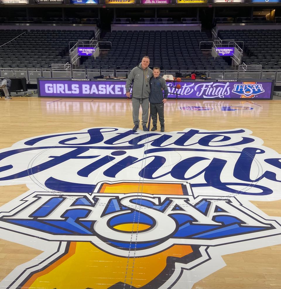 Brendan Huppenthal poses for a photo with his uncle, Lake Central coach Joe Huppenthal, before the Class 4A state championship game on Saturday, Feb. 24, 2024 at Gainbridge Fieldhouse.