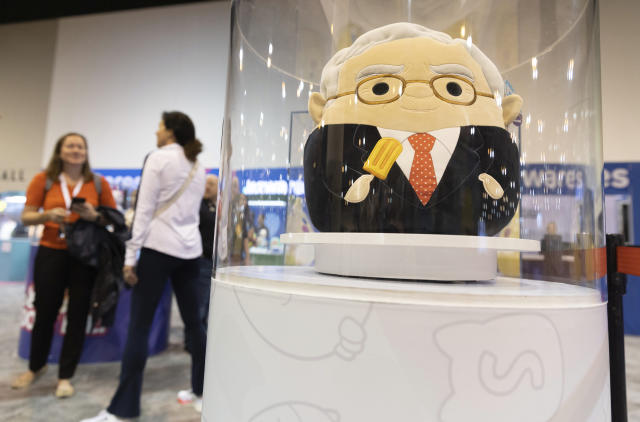 The Squishmallows booth sells toys modeled after Warren Buffett, pictured, and Charlie Munger in the exhibit hall for the Berkshire Hathaway annual meeting on Saturday, May 6, 2023, in Omaha, Neb. (AP Photo/Rebecca S. Gratz)