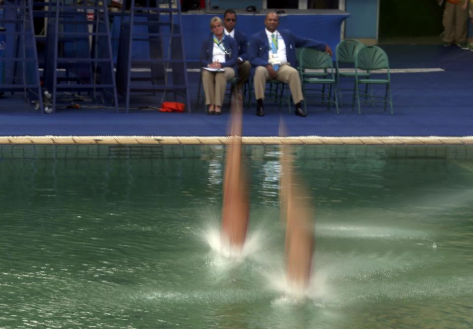 2016 Rio Olympics - Diving - Final - Women's Synchronised 10m Platform - Maria Lenk Aquatics Centre - Rio de Janeiro, Brazil - 09/08/2016. Roseline Filion (CAN) and Meaghan Benfeito (CAN) of Canada compete. REUTERS/Pilar Olivares FOR EDITORIAL USE ONLY. NOT FOR SALE FOR MARKETING OR ADVERTISING CAMPAIGNS.