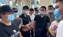 FILE PHOTO: People protest to demand repayment of loans and financial products at the Evergrande's headquarters, in Shenzhen