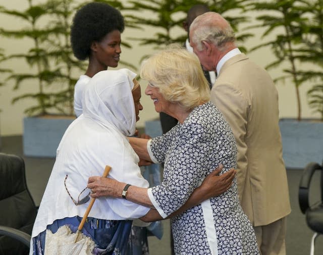 Camilla hugs a genocide survivor