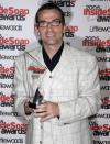 LONDON - SEPTEMBER 25: Bradley Walsh poses with his award for Best Actor as he arrives for the Inside Soap Awards at Floridita on September 25, 2006 in London, England. (Photo by Chris Jackson/Getty Images)