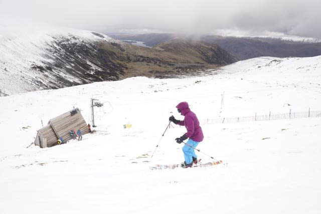 A skier makes their way down the slope at the Lake District Ski Club