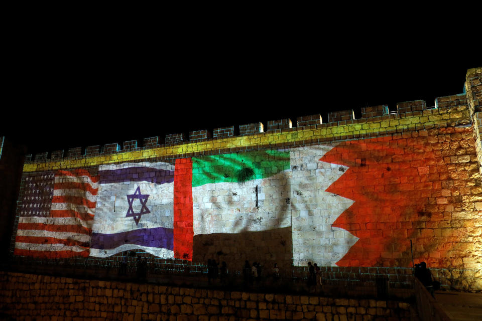 Image: National flags of Bahrain, UAE, Israel and the U.S. are projected on the walls of Jerusalem's Old City (Ronen Zvulun / Reuters)