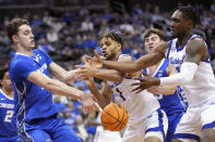 Seton Hall forward Tray Jackson (1) forward KC Ndefo, left, fight for a loose ball against Creighton center Ryan Kalkbrenner during the second half of an NCAA college basketball game, Wednesday, Feb. 8, 2023, in Newark, N.J. Creighton won 75-62. (AP Photo/Mary Altaffer)