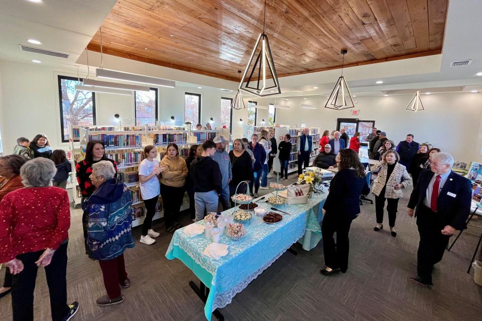 People visit during a grand opening celebration for the City of Sundown Library Thursday, Jan. 18, 2024, in Sundown.
