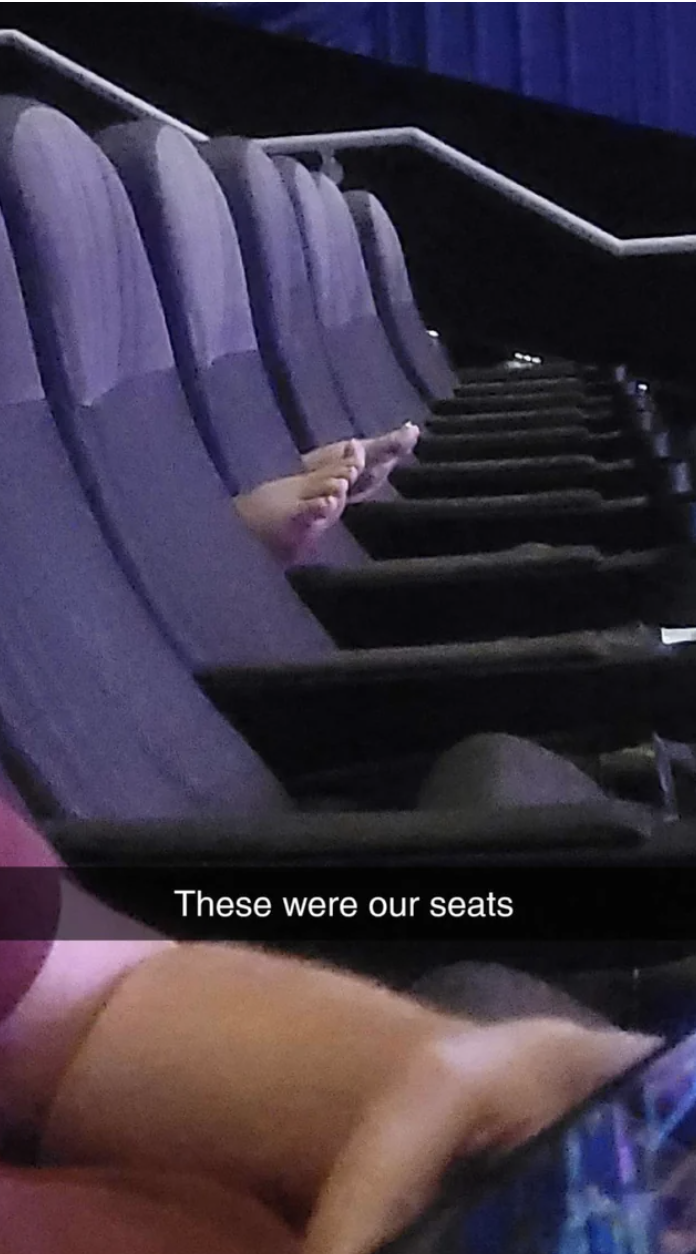 person with their bare feet on the seats