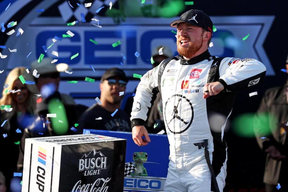 Apr 21, 2024; Talladega, Alabama, USA; NASCAR Cup Series driver Tyler Reddick (45) celebrates winning the GEICO 500 at Talladega Superspeedway.