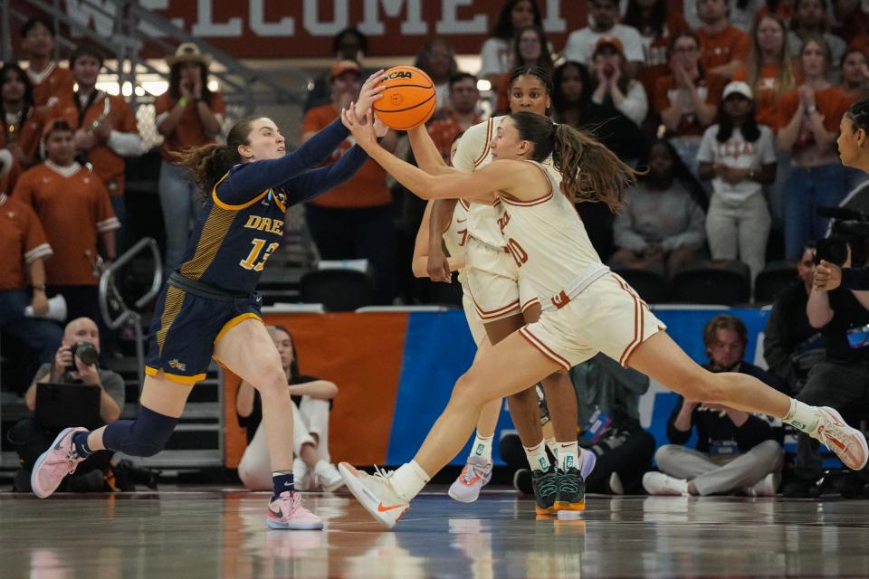 Texas guard Shay Holle and Drexel's Erin Sweeney fight for the ball during the Longhorns' 82-42 win at Moody Center on Friday. The No. 1-seeded Longhorns will play the Alabama-Florida State winner Sunday.