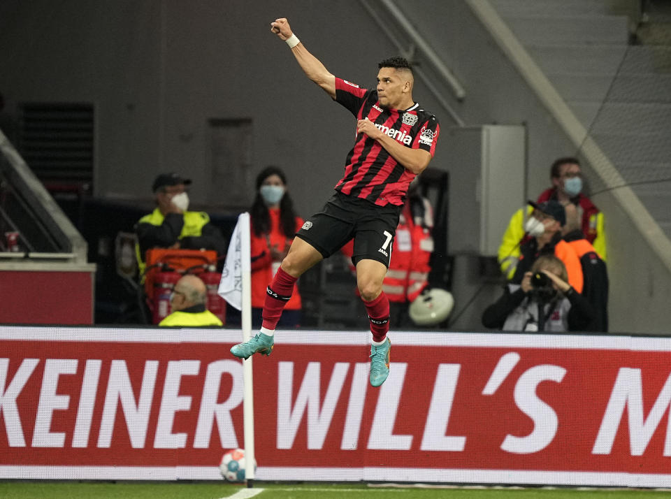 FILE - Bayer Leverkusen's Paulinho celebrates after scoring the opening goal during the German Bundesliga soccer match between Bayer Leverkusen and Eintracht Frankfurt in Leverkusen, Germany, Monday, May 2, 2022. Paulinho said some of the prejudice he endured, prompted him to leave Brazil for European soccer. In 2018, he moved to German club Bayer Leverkusen in a transfer worth $21 million. He said his faith was never an issue there. (AP Photo/Martin Meissner, File)