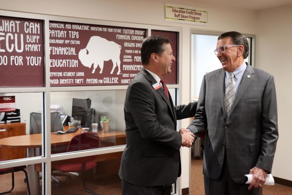 Eric Jenkins, President and CEO of Education Credit Union, and Dr. Walter Wendler, President of West Texas A&M University talk about the new Buff Smart program to teach financial responsibilty to students during a press conference at West Texas A&M Wednesday. 