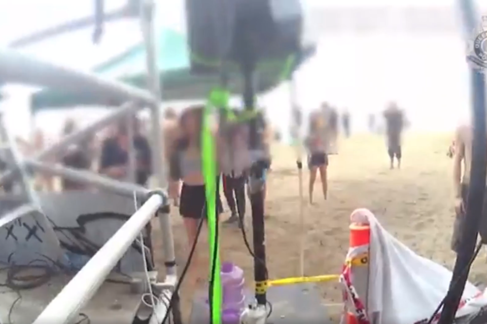 Footage shows the moment police shut down an illegal rave at a Queensland beach (Queensland Police)
