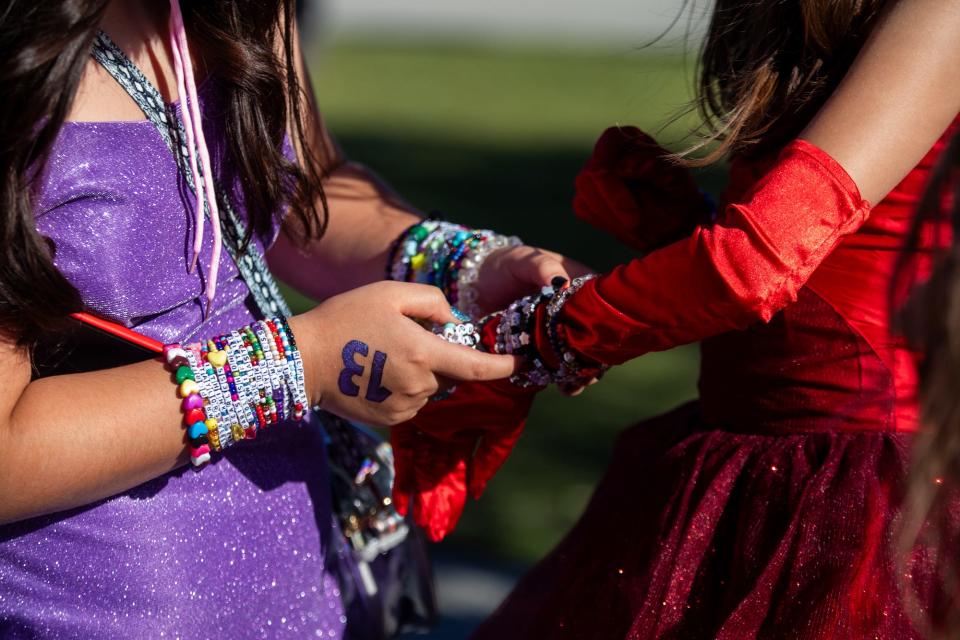 Taylor Swift fans trade friendship bracelets at the Eras Tour on August 3, 2023.