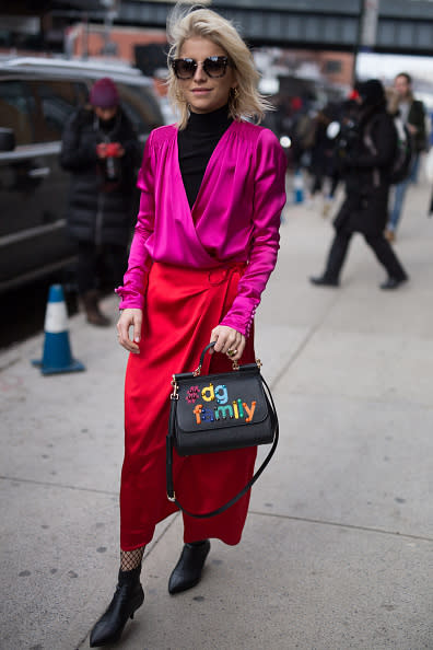 NEW YORK, NY – FEBRUARY 13: Caroline Daur is seen attending Carolina Herrera during New York Fashion Week wearing a pink top and red skirt on February 13, 2017 in New York City. (Photo by Matthew Sperzel/Getty Images)