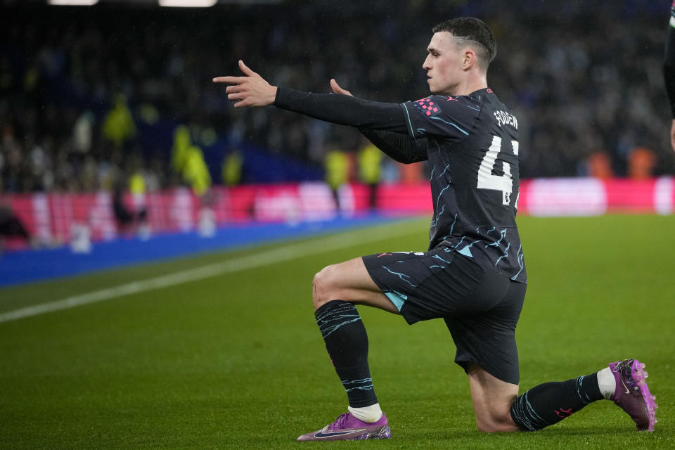 Manchester City's Phil Foden celebrates after scoring his side's third goal during the English Premier League soccer match between Brighton and Manchester City at the Falmer Stadium in Brighton, England, Thursday, April 25, 2024. (AP Photo/Kin Cheung)