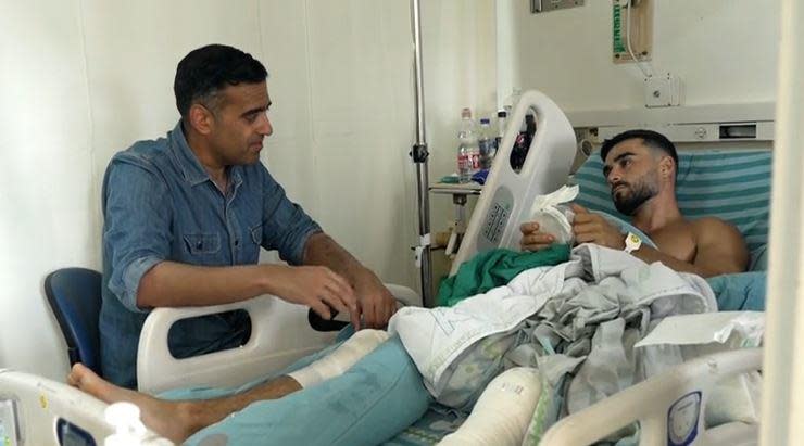 Gal Levy tells CBS News' Imtiaz Tyab about being shot by a Hamas militant as gunmen from the Palestinian faction stormed a music festival he was attending in southern Israel two days earlier, at a hospital in central Israel, Oct. 9, 2023.  / Credit: CBS News