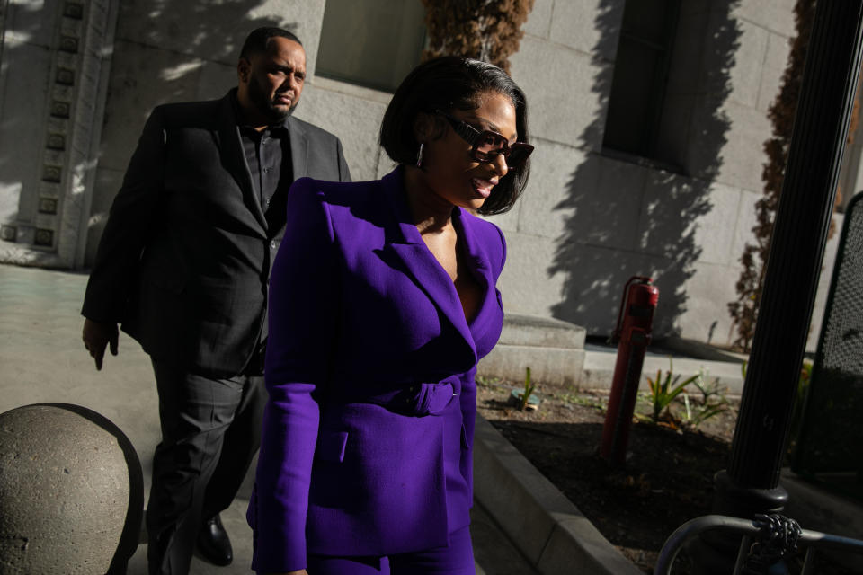 Megan Thee Stallion, whose legal name is Megan Pete, makes her way to the courthouse in Los Angeles on Dec. 13, 2022, to testify in the trial of rapper Tory Lanez for allegedly shooting her in 2020. / Credit: Jason Armond / Los Angeles Times via Getty Images