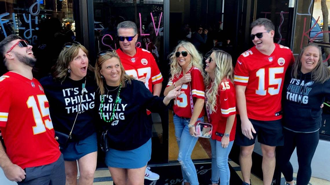 It was a friendly encounter when these Kansas City Chiefs fans from Greenwood, Mo. ran into a group of Philadelphia Eagles fans on the downtown streets of Phoenix Friday afternoon. Jake Renetzky, from left, was joined by Kent Waisner, his wife, Michele and son, Alex Waisner. The Chiefs will meet the Eagles Sunday in Super Bowl LVII.