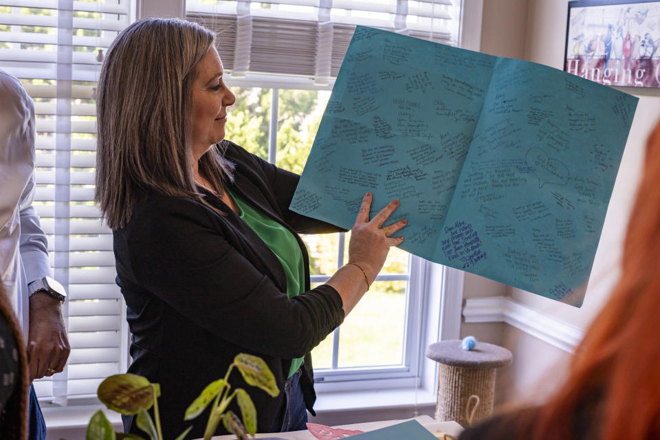 Abigail Zwerner’s mother Julie, looks through some letters and gifts sent to her daughter by people across the country at an undisclosed location in Virginia on March 20, 2023.  (Carlos Bernate for NBC News)
