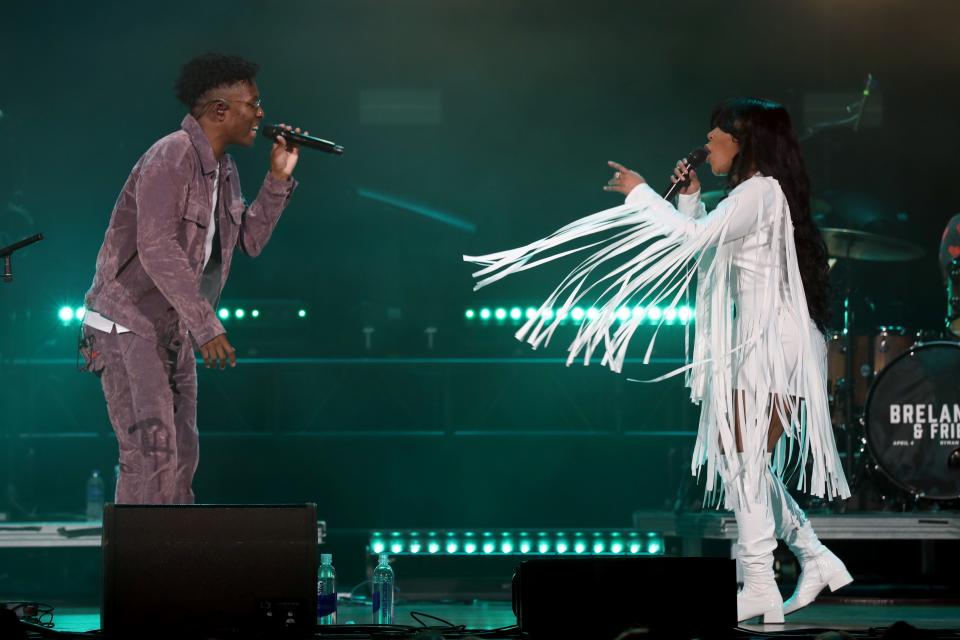 BRELAND and K. Michelle perform onstage for "BRELAND & Friends" benefit for Oasis Center presented by Amazon Music at Ryman Auditorium on April 04, 2023 in Nashville, Tennessee.