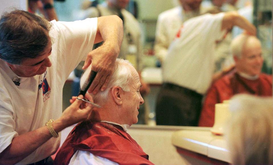 <p>McCain gets a haircut in his hotel prior to the start of the opening sessions of the Republican National Convention in San Diego on August 12, 1996.</p>
