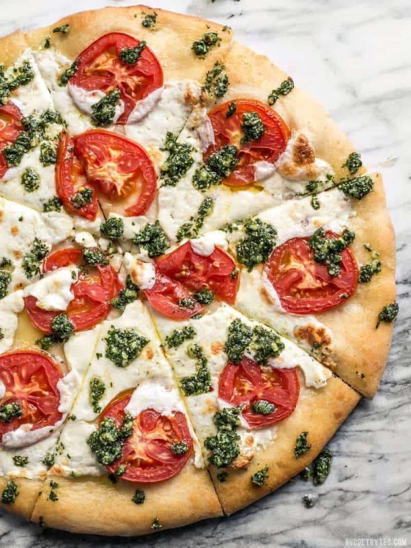 <p>Budget Bytes</p><p>Take your Margherita pizza up a level with a drizzle of zesty parsley pesto. This white pizza is anything but boring.</p><p><strong>Get the recipe: <a href="https://www.budgetbytes.com/white-pizza-with-parsley-pesto-drizzle/" rel="nofollow noopener" target="_blank" data-ylk="slk:White Pizza with Parsley Pesto Drizzle;elm:context_link;itc:0;sec:content-canvas" class="link ">White Pizza with Parsley Pesto Drizzle</a></strong></p>