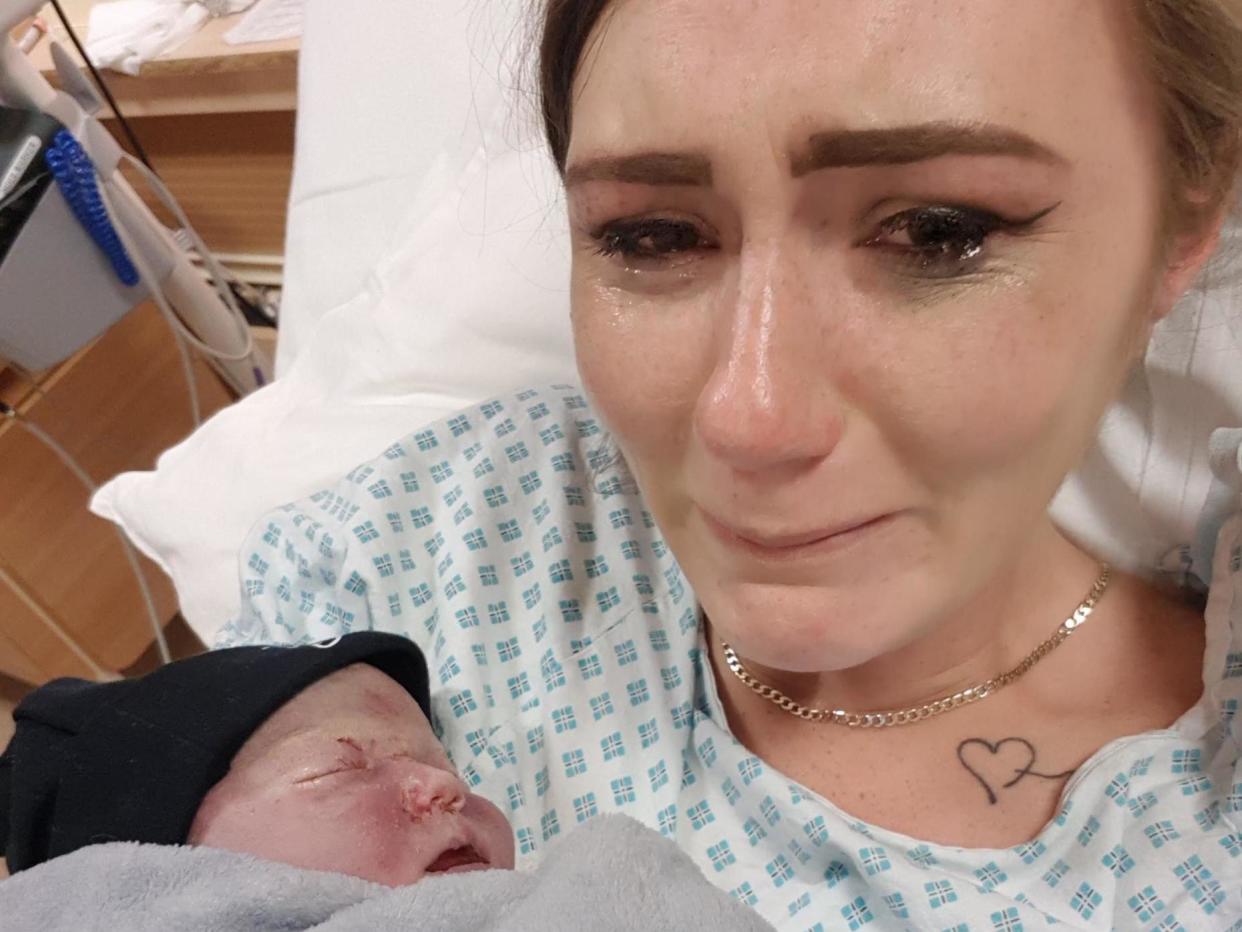 Stephanie Broadley cradles her stillborn baby Beau in a heartbreaking image. Ms Broadley is calling for action on maternity safety in the NHS