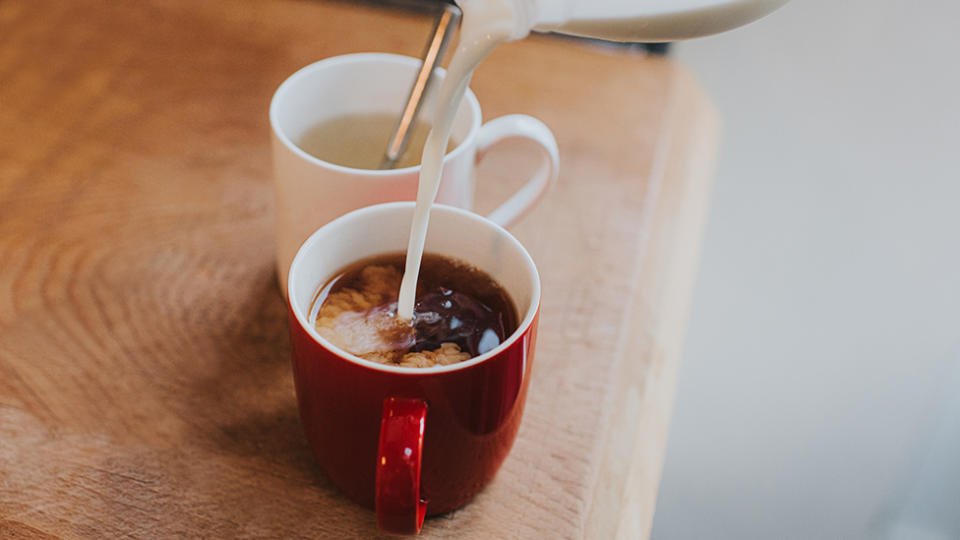 Pouring milk into coffee