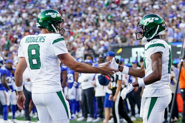 New York Jets quarterback Aaron Rodgers (8) calls out a play to his  teammates during the first half of an NFL preseason football game against  the New York Giants, Saturday, Aug. 26