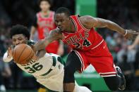 Chicago Bulls' Javonte Green (24) battles Boston Celtics' Marcus Smart (36) for a loose ball during the first half of an NBA basketball game, Monday, Nov. 1, 2021, in Boston. (AP Photo/Michael Dwyer)