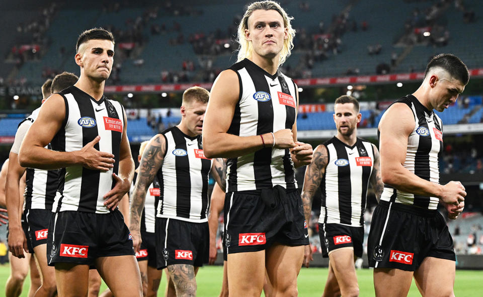 Collingwood players, pictured here after their ugly loss to the Sydney Swans.