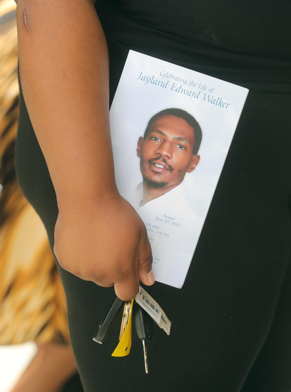 A person leaves the funeral of Jayland Walker at the Akron Civic Theatre on Wednesday, July 13, 2022 in Akron, Ohio.