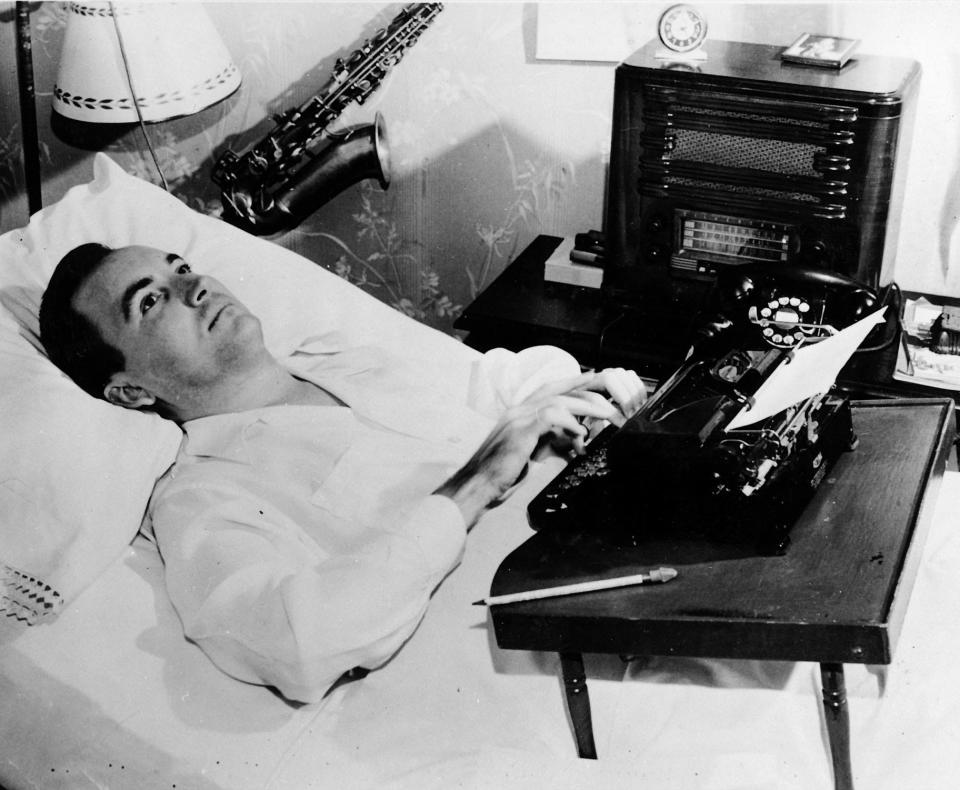 A 1956 photograph of Hugh Edward Sandefur at work in his bed. For 29 years, from 1944 to 1973,  he was a reporter and on-air personality for WSON radio and for nearly 24 of those years, 1949 to 1973, he was simultaneously a reporter for The Gleaner. He had been bedridden since 1932 with rheumatoid arthritis, but he didn't let that stop him from becoming Henderson's foremost journalist of his time.