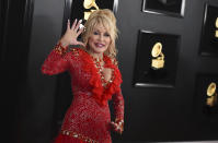 FILE - Dolly Parton arrives at the 61st annual Grammy Awards on Feb. 10, 2019, in Los Angeles. The Grammy-winning legend's 1980's hit "9 to 5" has been flipped by Squarespace, the company that helps users build and host their own websites, for a Super Bowl commercial debuting Tuesday, Feb. 2, 2021. Oscar winner Damien Chazelle of "La La Land" fame directed the spot. (Photo by Jordan Strauss/Invision/AP, File)