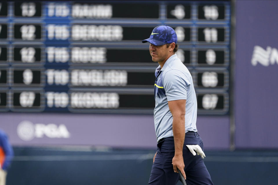 Brooks Koepka reacts after missing a putt on the ninth hole during the final round of the PGA Championship golf tournament at TPC Harding Park Sunday, Aug. 9, 2020, in San Francisco. (AP Photo/Charlie Riedel)