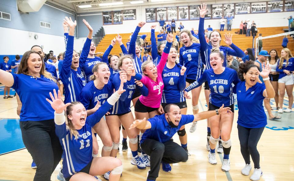 Members of the Barron Collier volleyball team celebrate after beating Osceola in the Class 5A regional final at Barron Collier High School in Naples on Saturday, Nov. 6, 2021. Barron Collier moves on to the state semifinals on Nov. 13.