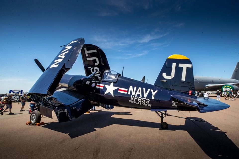 Guests get a close look at a Navy F-4U Corsair World War II-era fighter aircraft at the 48th annual Sun 'n Fun Aerospace Expo in Lakeland in 2022.