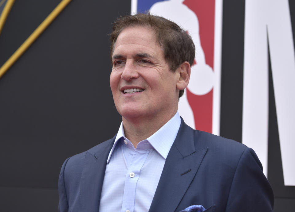 FILE - Dallas Mavericks owner Mark Cuban arrives at the NBA Awards in Santa Monica, Calif., in this Monday, June 24, 2019, file photo. The NBA said Wednesday, Feb. 10, 2021, the national anthem will be played in arenas “in keeping with longstanding league policy” after Dallas Mavericks owner Mark Cuban revealed he had decided not to play it before his team's home games this season. (Photo by Richard Shotwell/Invision/AP, File)
