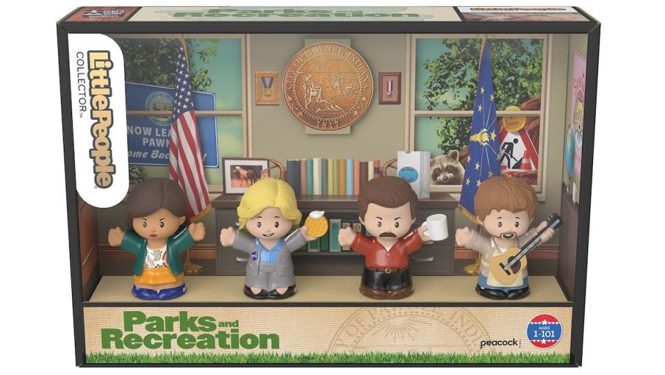 Fisher-Price's Little People Parks and Rec set with the four figures displayed in the office-themed box