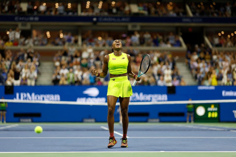 Coco Gauff celebrates after punching her ticket to the 2023 US Open final.