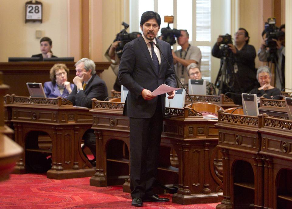 Sen. Kevin DeLeon, D-Los Angeles, speaks before voting on a resolution to suspend three Democrats who face charges in criminal cases on the floor of the Senate in Sacramento, Calif., on Friday, March 28, 2014. The resolution ,which passed 28-1, prevents Democratic Sens. Ron Calderon, Leland Yee and Rod Wright from exercising any power of their office until the pending criminal cases against them have been resolved.(AP Photo/Steve Yeater)