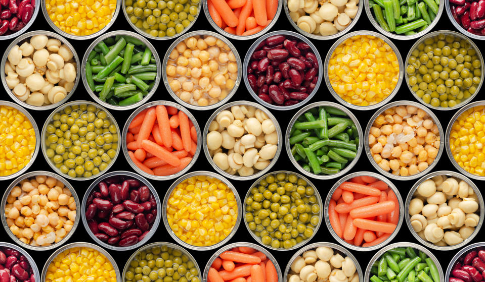 Seamless food background made of opened canned foods 