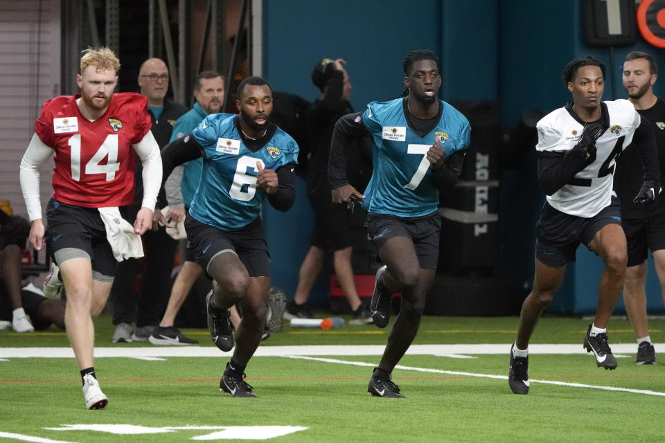 From left, quarterback Brennan Armstrong (14), wide receiver Jarvis Landry (6), wide receiver Brain Thomas Jr. (7) and cornerback De'Antre Prince (24) participate during the Jacksonville Jaguars NFL rookie camp football practice, Friday, May 10, 2024, in Jacksonville, Fla. (AP Photo/John Raoux)