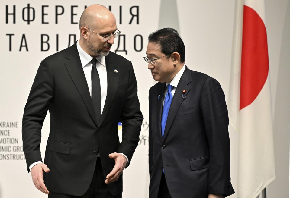 Ukraine's Prime Minister Denys Shmyhal speaks with Japanese Prime Minister Fumio Kishida during the Japan-Ukraine Conference for Promotion of Economic Growth and Reconstruction at Keidanren Kaikan building in Tokyo, Monday, Feb. 19, 2024. (Kazuhiro Nogi/Pool Photo via AP)