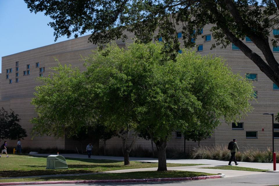 Students and staff walk around the Del Mar College Heritage Campus after an active-shooter report was confirmed to be false on Thursday, April 13, 2023, in Corpus Christi, Texas.