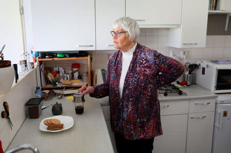 Clara Jas makes herself a coffee in her house in Zwolle, the Netherlands April 3, 2018. Picture taken April 3, 2018. REUTERS/Michael Kooren